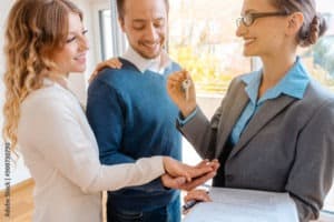 Tenants taking keys from landlord